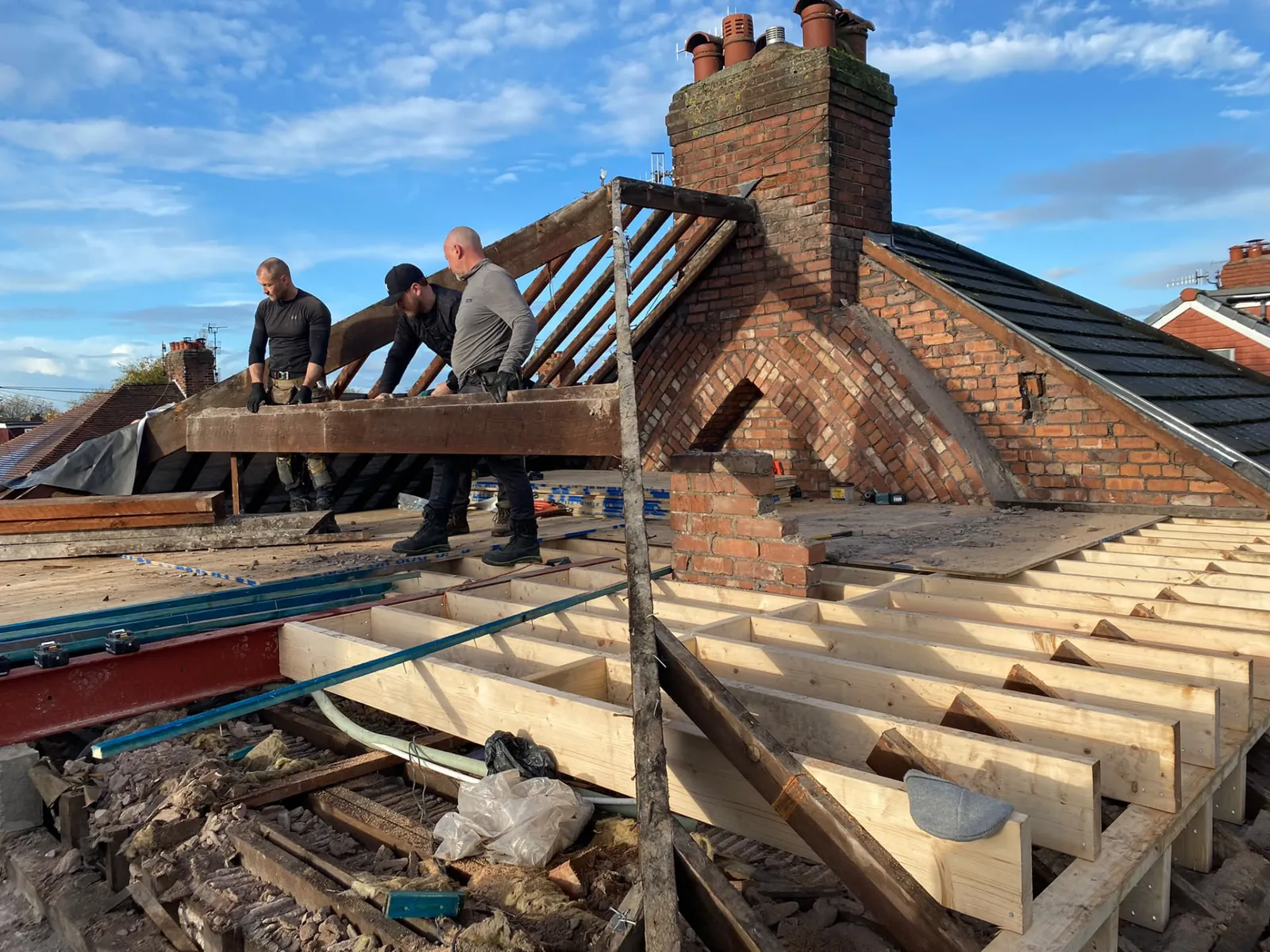 Builders installing new floor joists and steel for a loft conversion